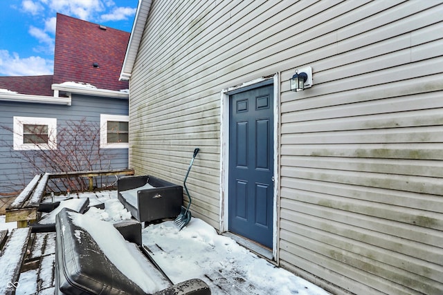 view of snow covered property entrance