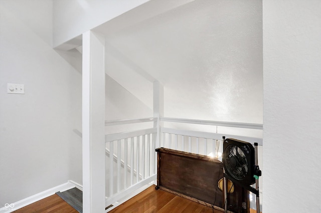 stairs featuring wood-type flooring