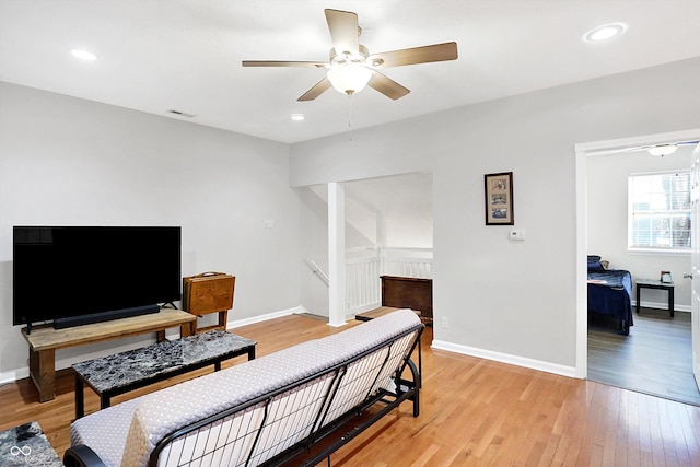 interior space with ceiling fan and light wood-type flooring