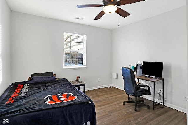 bedroom featuring dark hardwood / wood-style flooring and ceiling fan