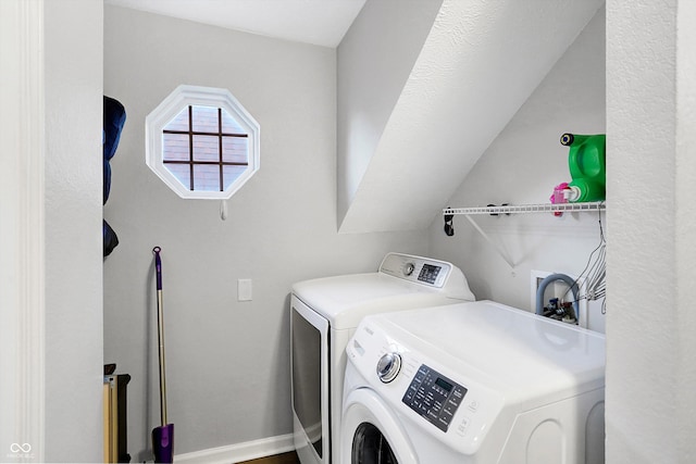 washroom featuring washer and clothes dryer