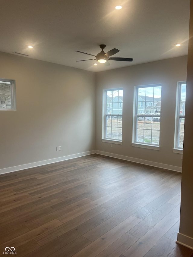 unfurnished room featuring baseboards, recessed lighting, dark wood-style flooring, and ceiling fan