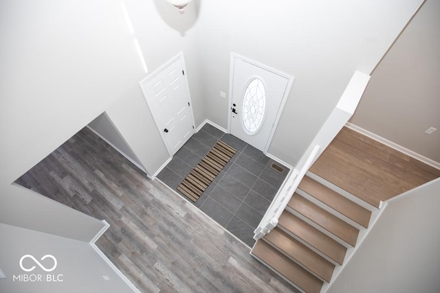 entryway featuring dark tile patterned flooring