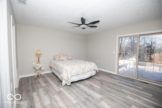 bedroom featuring ceiling fan and hardwood / wood-style floors