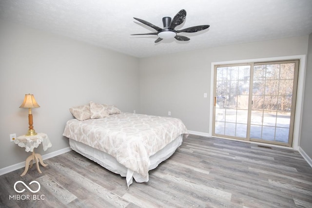 bedroom featuring ceiling fan and wood-type flooring