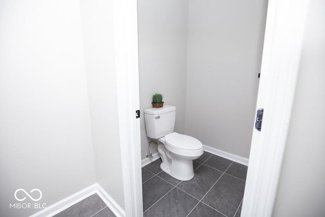 bathroom with tile patterned flooring and toilet