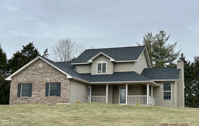 view of front of property featuring a front lawn and covered porch