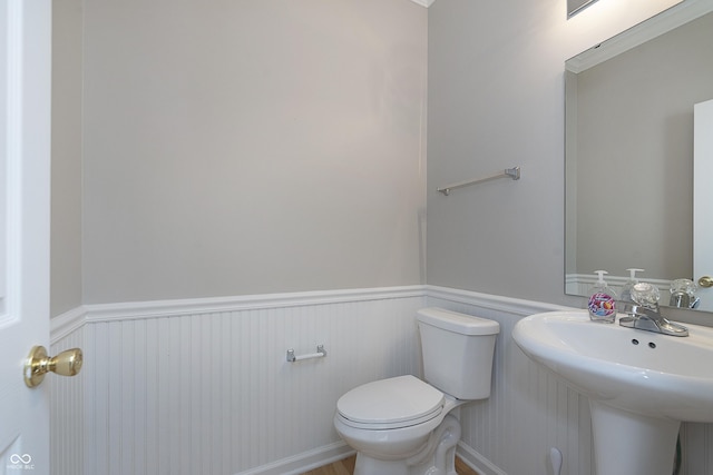 bathroom with toilet and sink