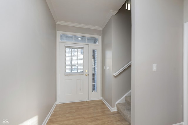 foyer featuring crown molding and light hardwood / wood-style floors