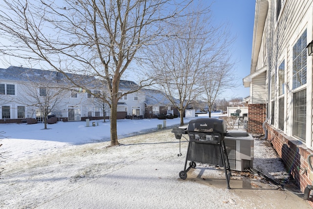 view of yard layered in snow