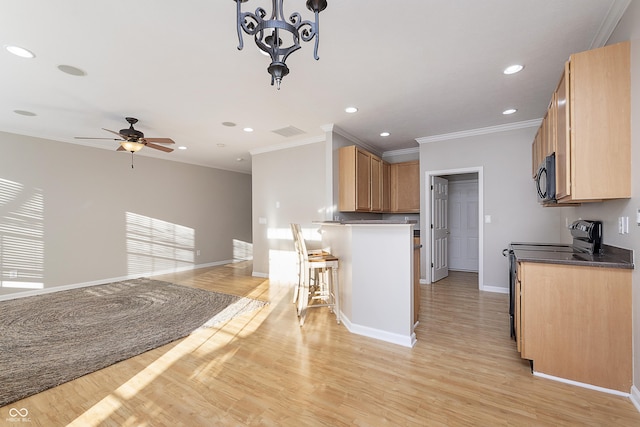 kitchen with crown molding, light hardwood / wood-style flooring, pendant lighting, ceiling fan, and black appliances