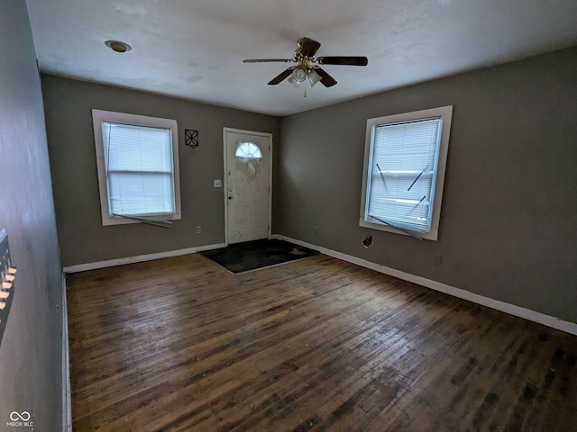 foyer entrance with dark hardwood / wood-style floors and ceiling fan