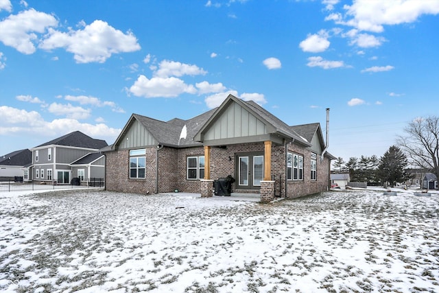 view of snow covered house