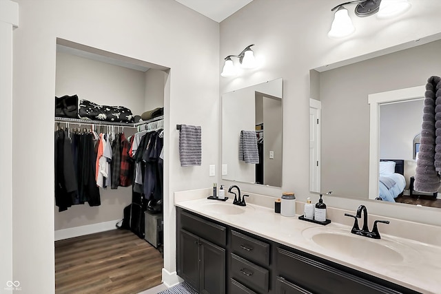 bathroom with vanity and wood-type flooring