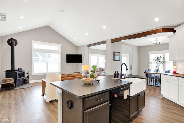 kitchen with sink, white cabinetry, a center island with sink, light wood-type flooring, and dishwasher