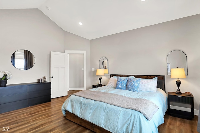 bedroom with dark hardwood / wood-style flooring and high vaulted ceiling