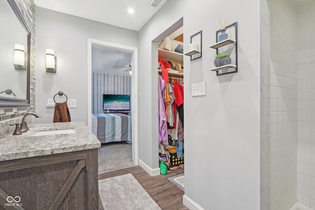 bathroom with vanity and hardwood / wood-style flooring