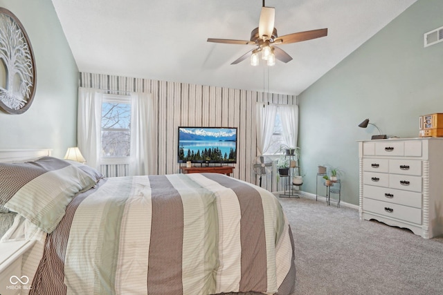 carpeted bedroom featuring ceiling fan and vaulted ceiling