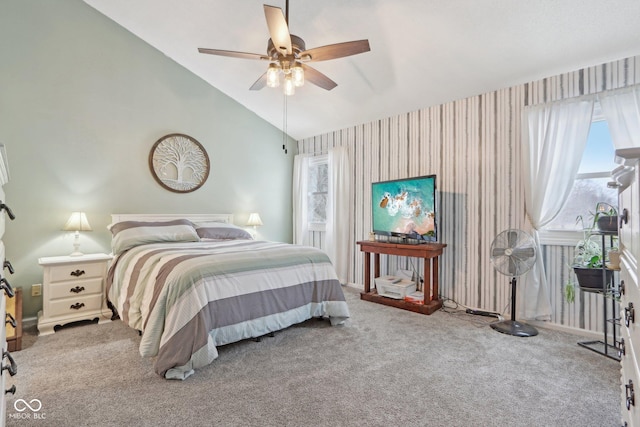 bedroom with vaulted ceiling, carpet floors, and ceiling fan