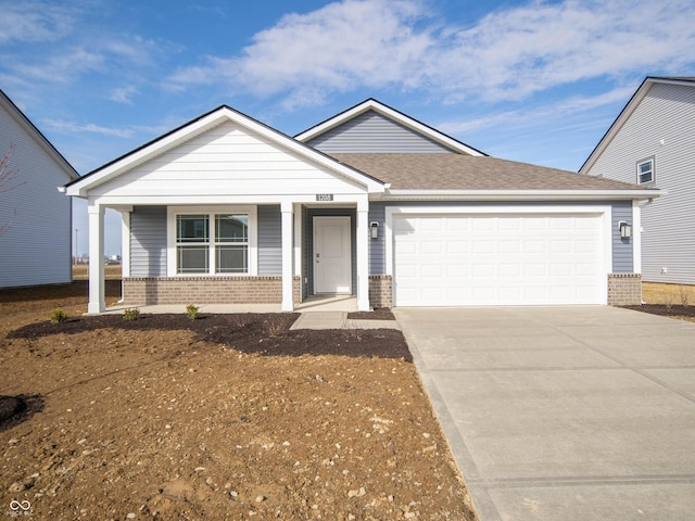 view of front of property with a garage and a porch