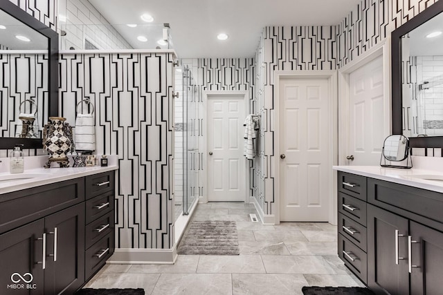 bathroom with walk in shower and vanity