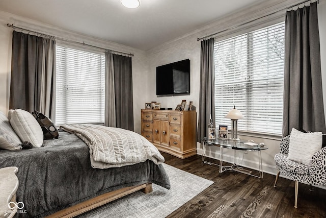 bedroom featuring dark hardwood / wood-style flooring and ornamental molding