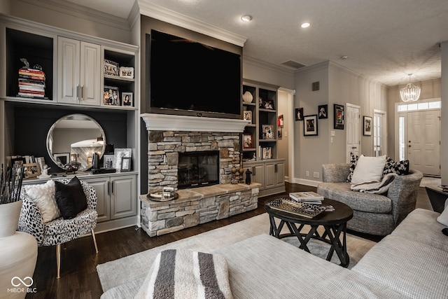 living room with crown molding, dark hardwood / wood-style floors, and a fireplace