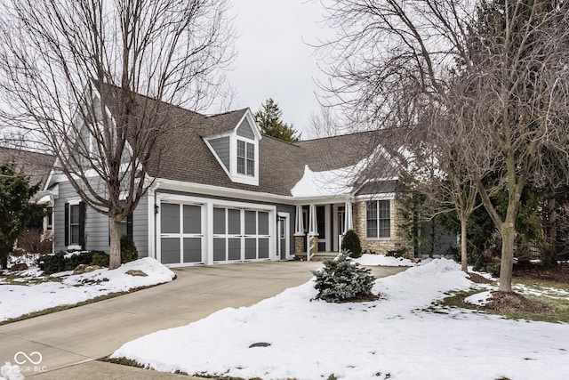 cape cod-style house with a garage