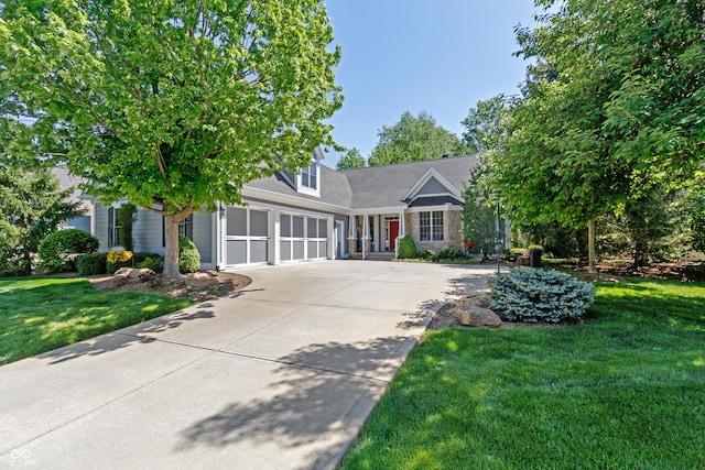 view of front of home with a garage and a front yard