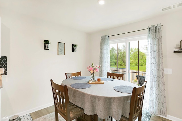 dining area featuring wood-type flooring