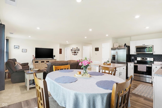 dining space featuring light hardwood / wood-style floors