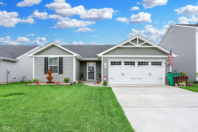 view of front facade with a garage and a front lawn