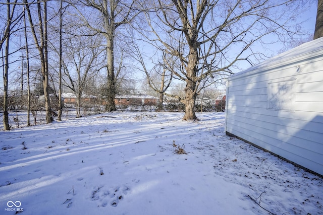 view of yard layered in snow