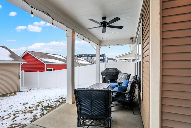 snow covered patio with ceiling fan