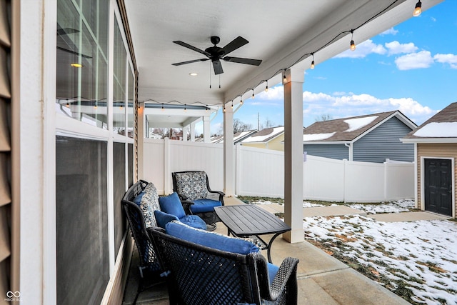 snow covered patio with ceiling fan