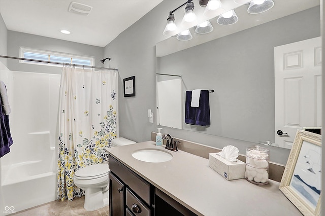 full bathroom with vanity, toilet, and shower / bath combo with shower curtain