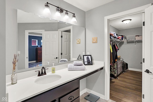 bathroom featuring vanity and hardwood / wood-style floors