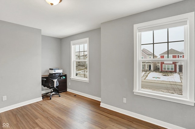 office space with hardwood / wood-style floors