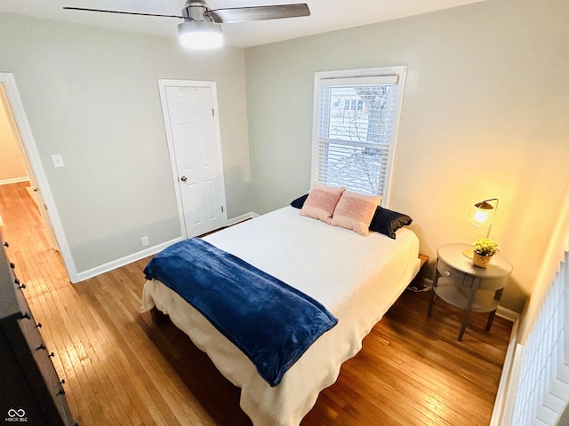 bedroom featuring hardwood / wood-style flooring and ceiling fan