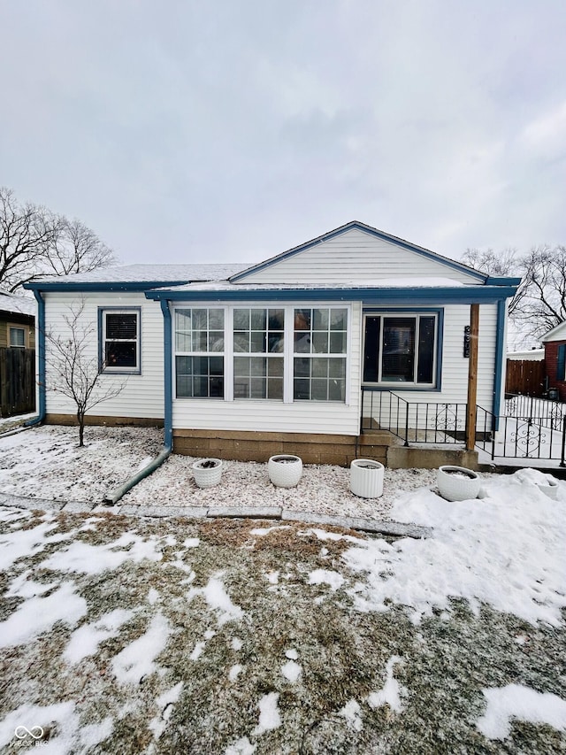 view of snow covered house