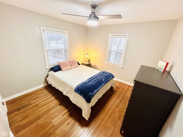 bedroom featuring wood-type flooring and ceiling fan