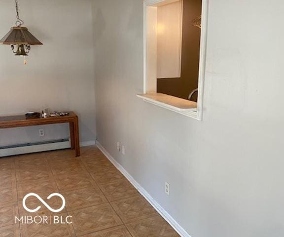 hallway featuring a baseboard radiator