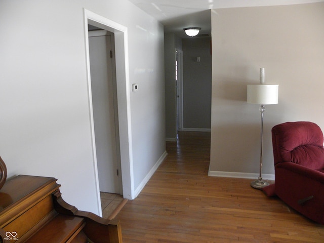 hall with wood-type flooring