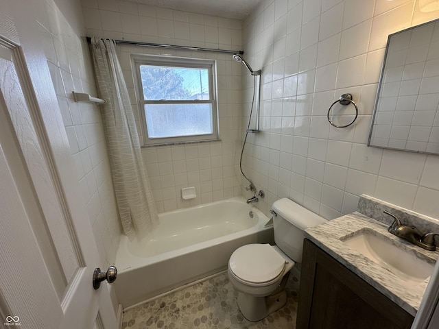 full bathroom with tasteful backsplash, tile walls, vanity, toilet, and shower / bath combo