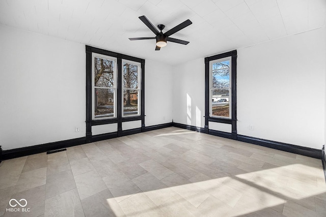 empty room featuring ceiling fan