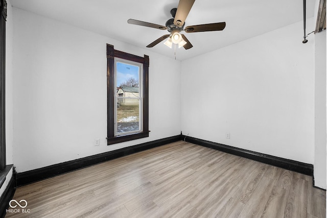 spare room featuring ceiling fan and light hardwood / wood-style flooring