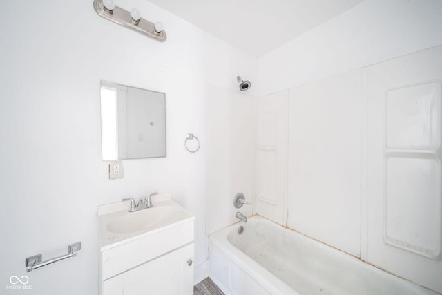 bathroom with vanity and  shower combination