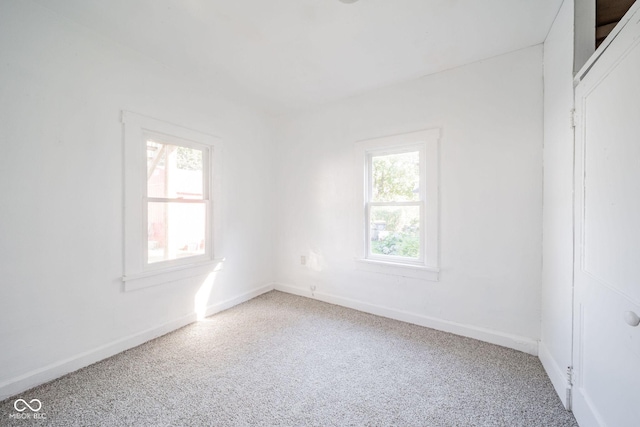 unfurnished room featuring carpet