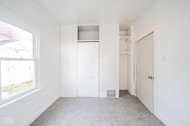 unfurnished bedroom featuring carpet flooring