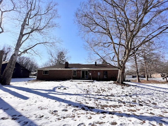 view of snow covered house